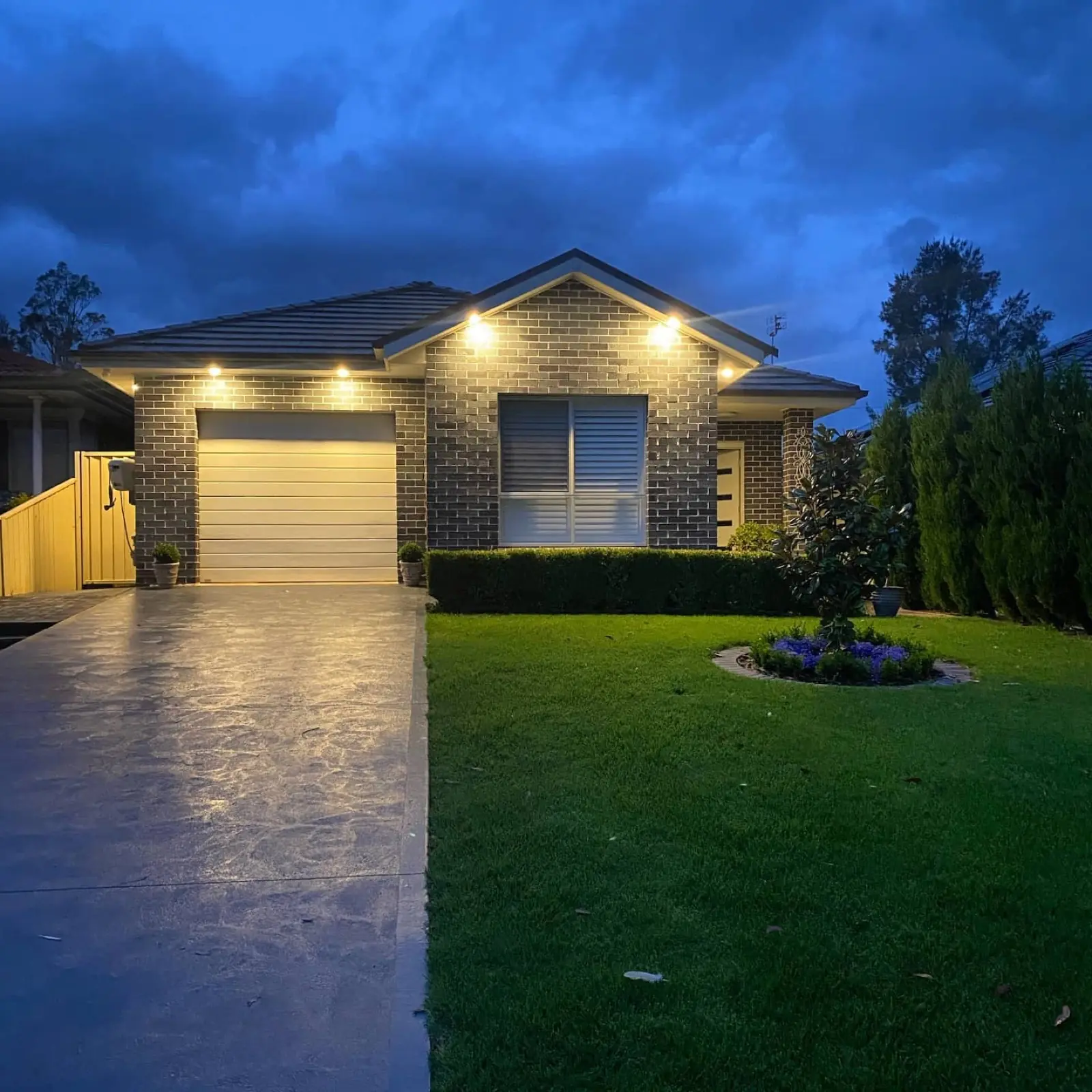 Warm LED downlights installed throughout a Sydney living room