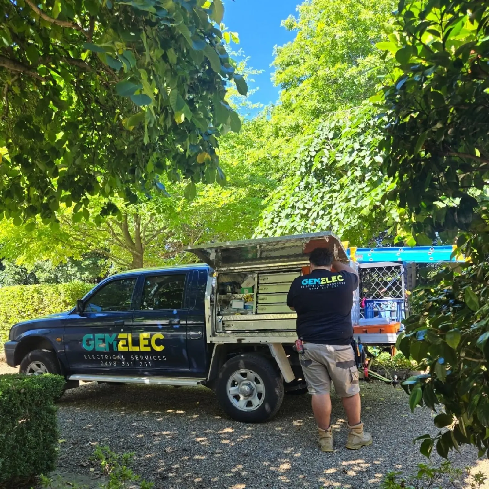 Mani standing in front of a Gemelec work truck in Sydney